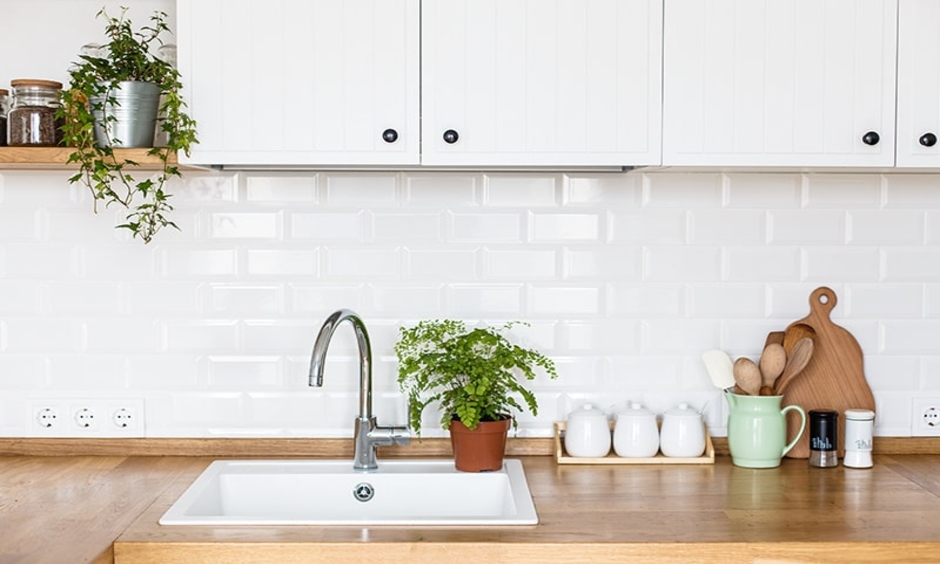 Simple, modern kitchen sink in a minimalist design standing on a worktop