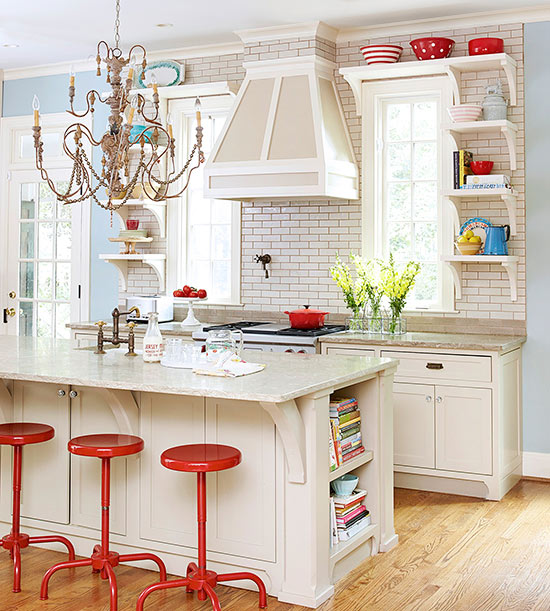 A chic, eclectic kitchen showcases sophisticated details and relaxed furnishings, as well as a playful chandelier
