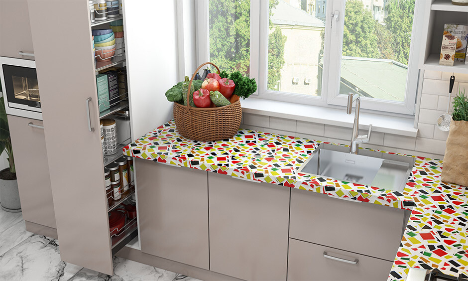 A vibrant kitchen countertop design in India against a muted background creates an eye-catching appearance