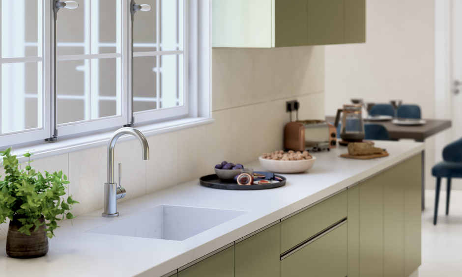 Modern white marble kitchen sink with a deep single bowl
