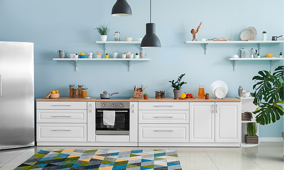 Small kitchen design with aqua blue wall color and white cabinets