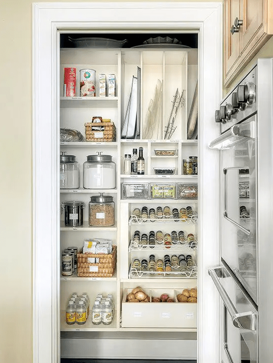 a small pantry with a large open shelf, metal shelves and jars and baskets, some food and other things