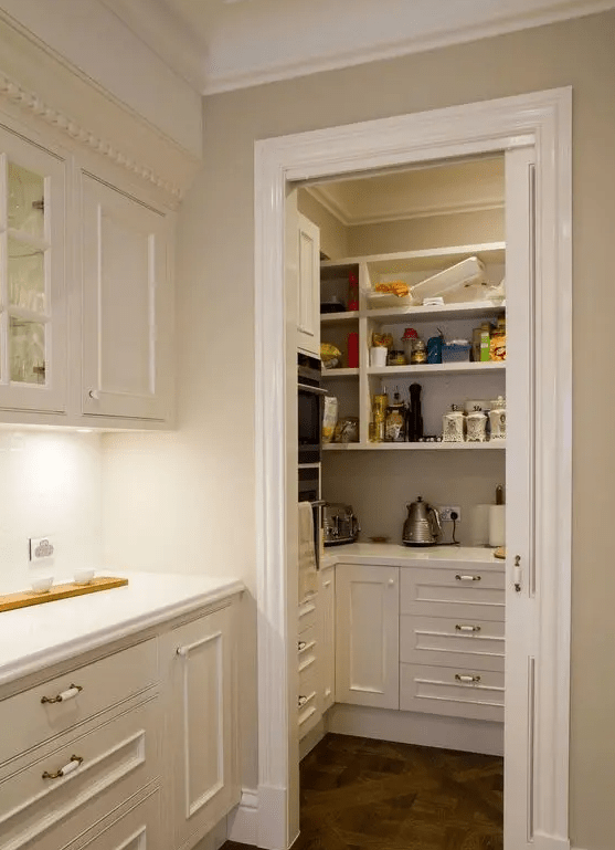 a small pantry with open shelving and built-in storage cabinets, appliances, food and cookware to keep the kitchen clean and tidy