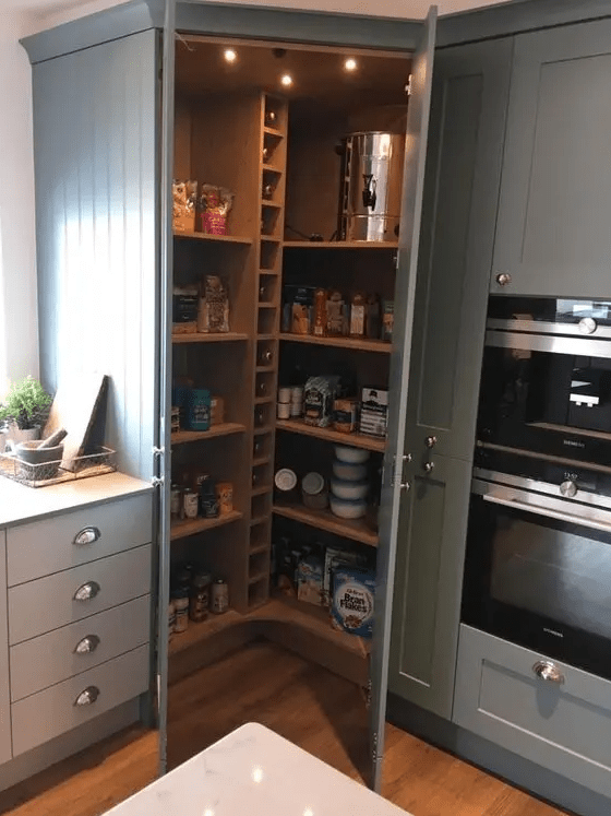 a small rustic pantry with built-in shelves and wine bottle storage, lights and food, drinks and other things