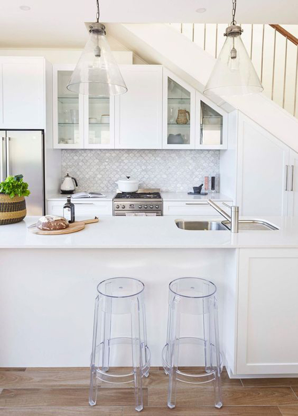 minimalist kitchen under the stairs in country house style