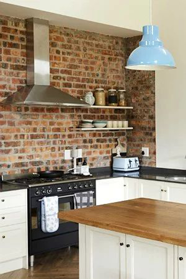 Industrial style kitchen with exposed brick