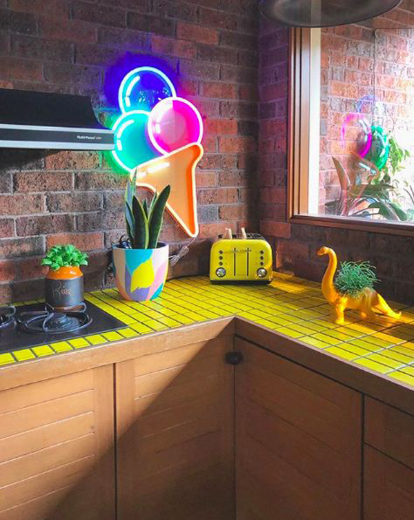 Fun rainbow kitchen design with neon lights