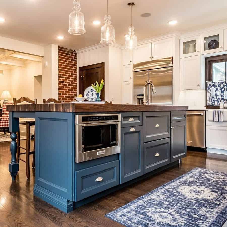 modern small kitchen with blue island 