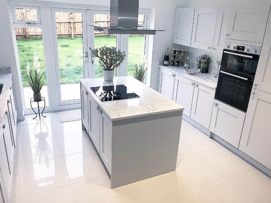 Gray modern kitchen with granite work island 