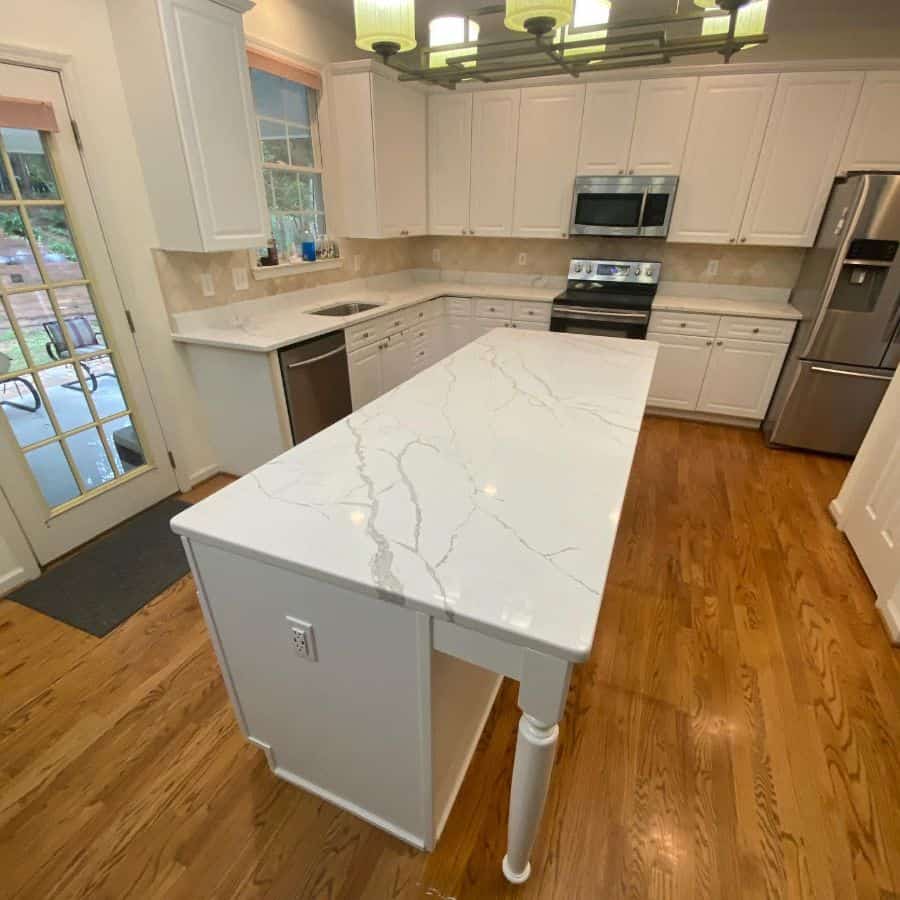 small kitchen with island with quartz top 