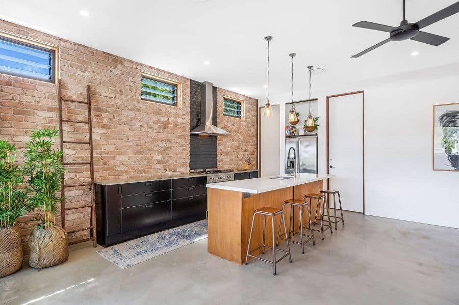 Minimalist kitchen with brick wallpaper wall 
