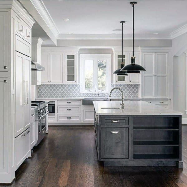 White farmhouse kitchen with low hanging lights 