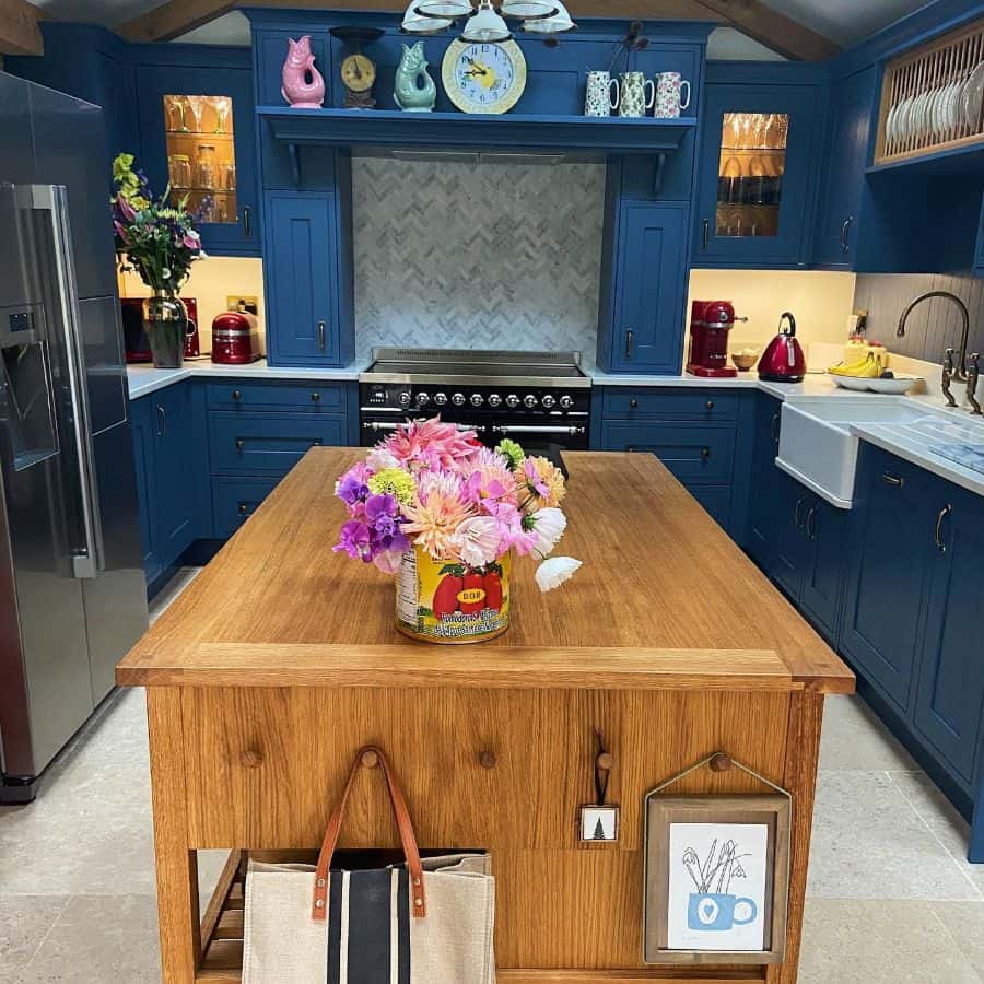 Blue cupboard kitchen with wooden island 