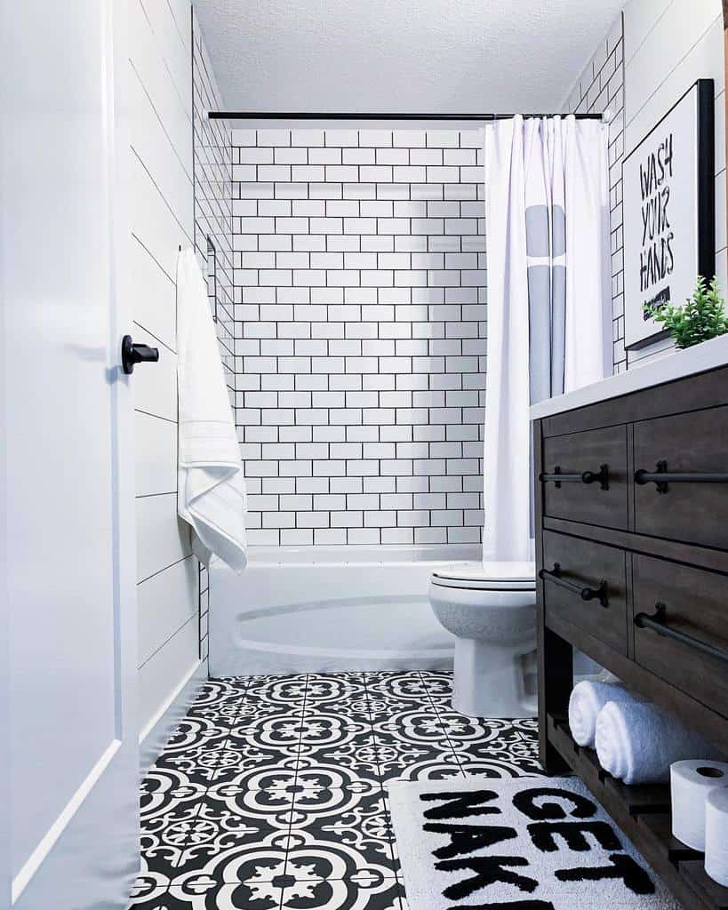 Modern basement bathroom with white tiled wall 