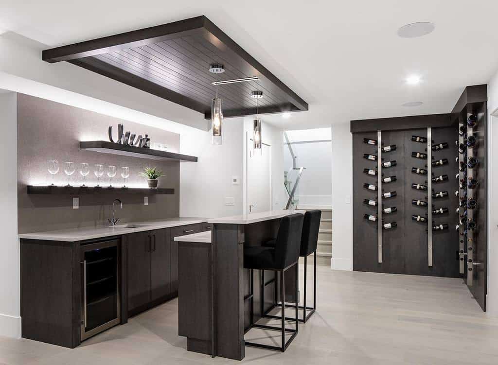 Modern basement kitchen with wall wine racks