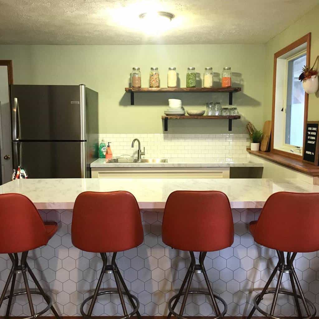 Green vintage kitchen with white tiled splashback 