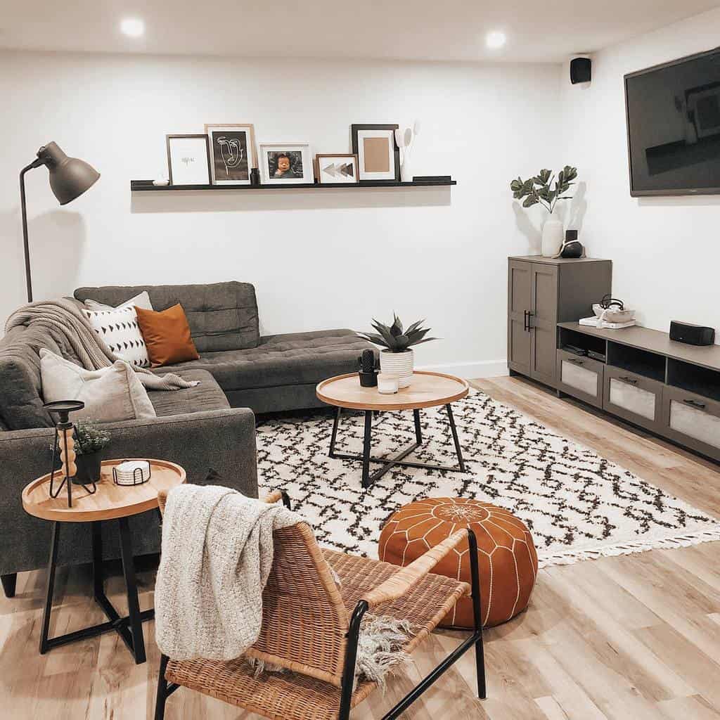White basement living room with gray sofa 