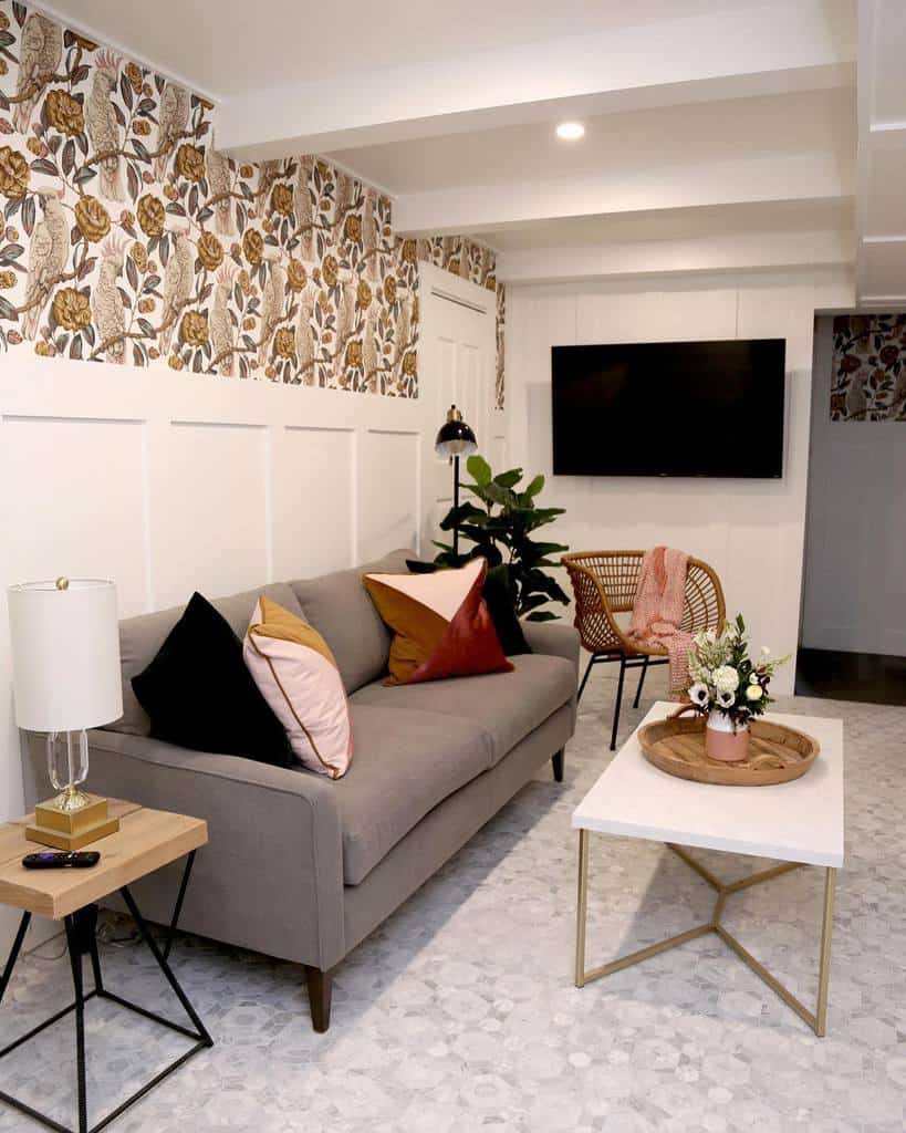 Small basement living room with floral and cockatoo wallpaper 