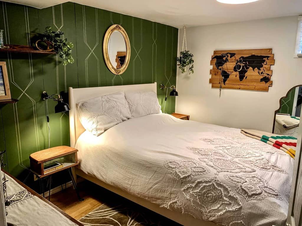 Vintage basement bedroom remodel with green accent wall 