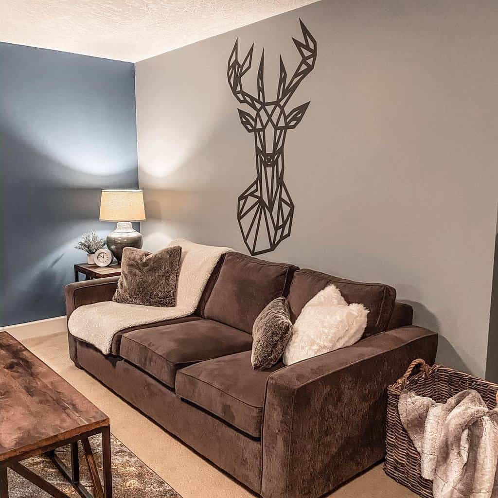 Deer wall art in living room with brown sofa 