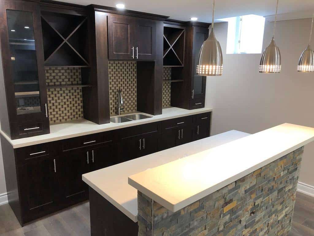 remodeled basement kitchen with pendant lighting 