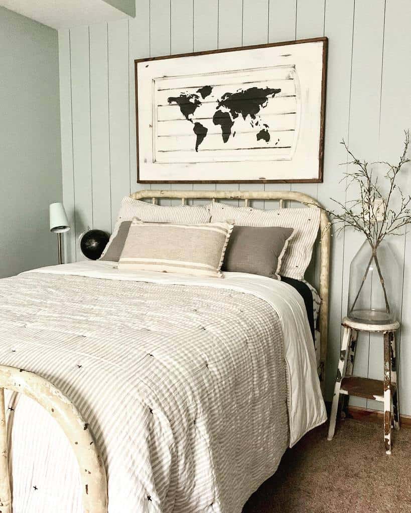 Blue step wall in rustic bedroom with white vintage bed frame 