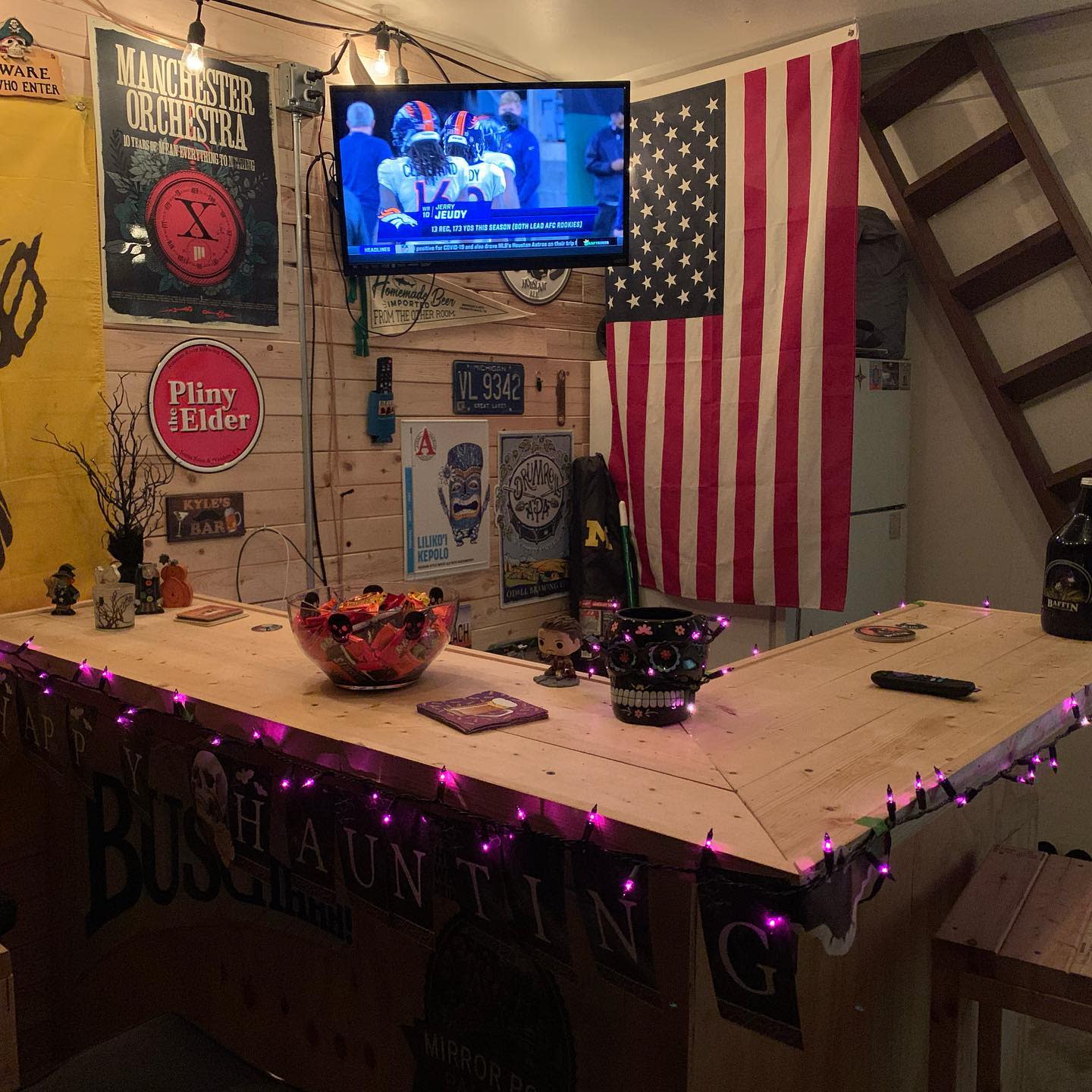Shiplap walls, wooden bar, garage, American flag, wall mounted TV string lights