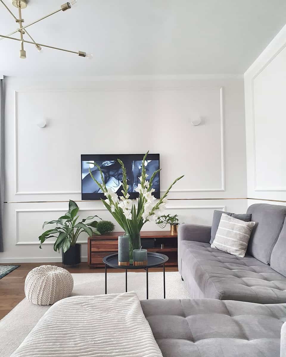 White living room, gray L-shaped sofa 