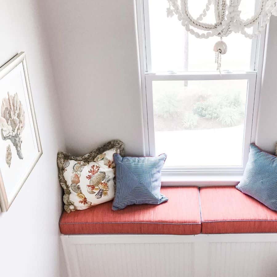 Window corner, orange cushions 