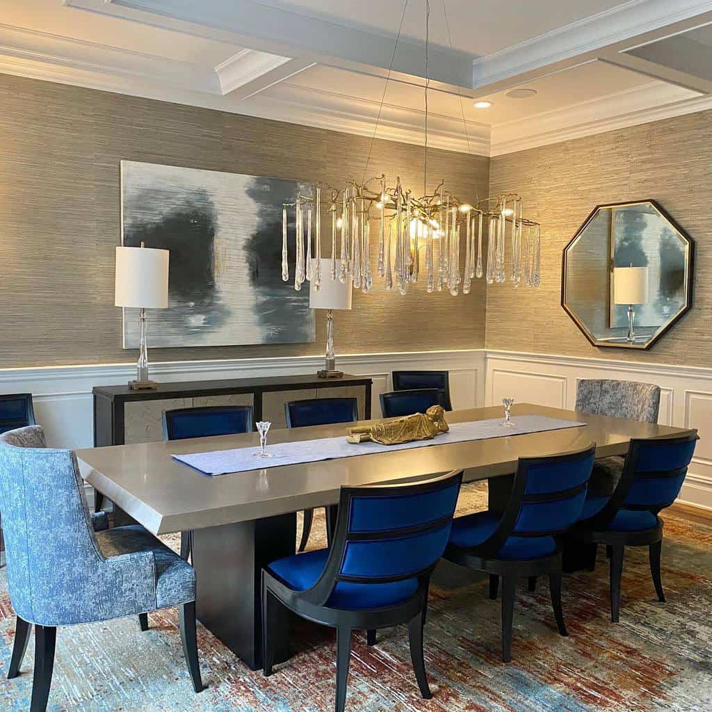 Luxurious dining room with long table and blue chairs 