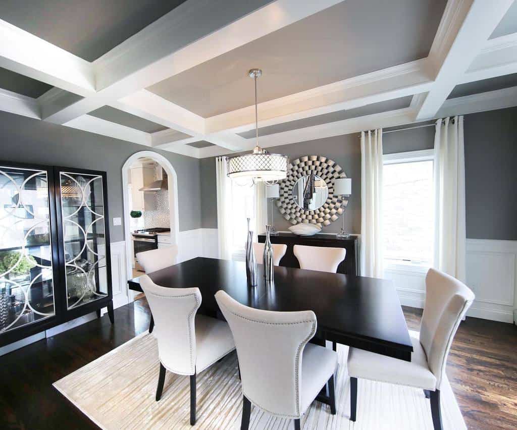 White and gray transitional dining room, black table with gray chairs