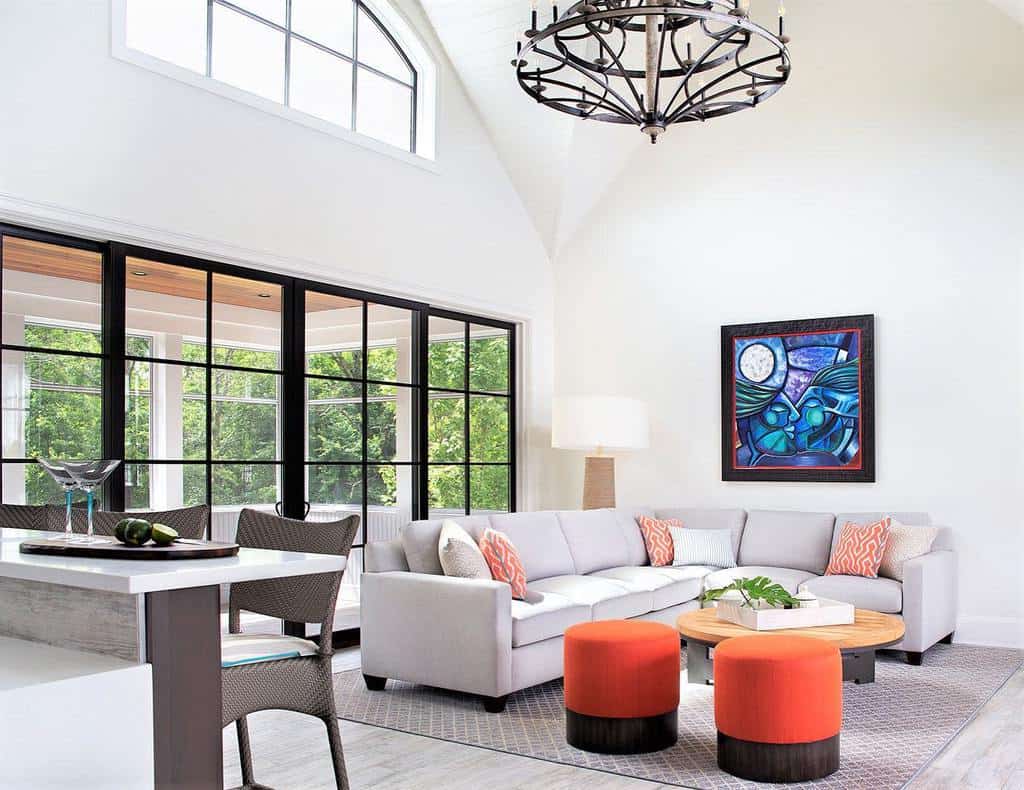Modern transitional living room with gray L-shaped sofa and abstract wall art
