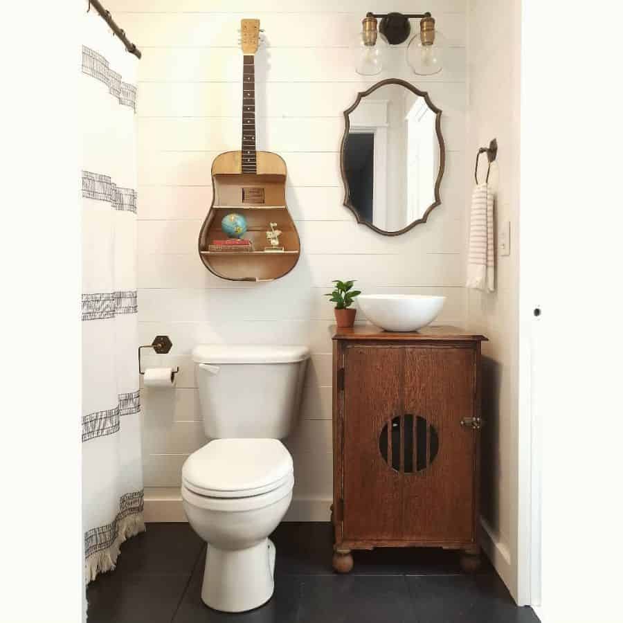 small vintage bathroom with unique guitar wall shelf 