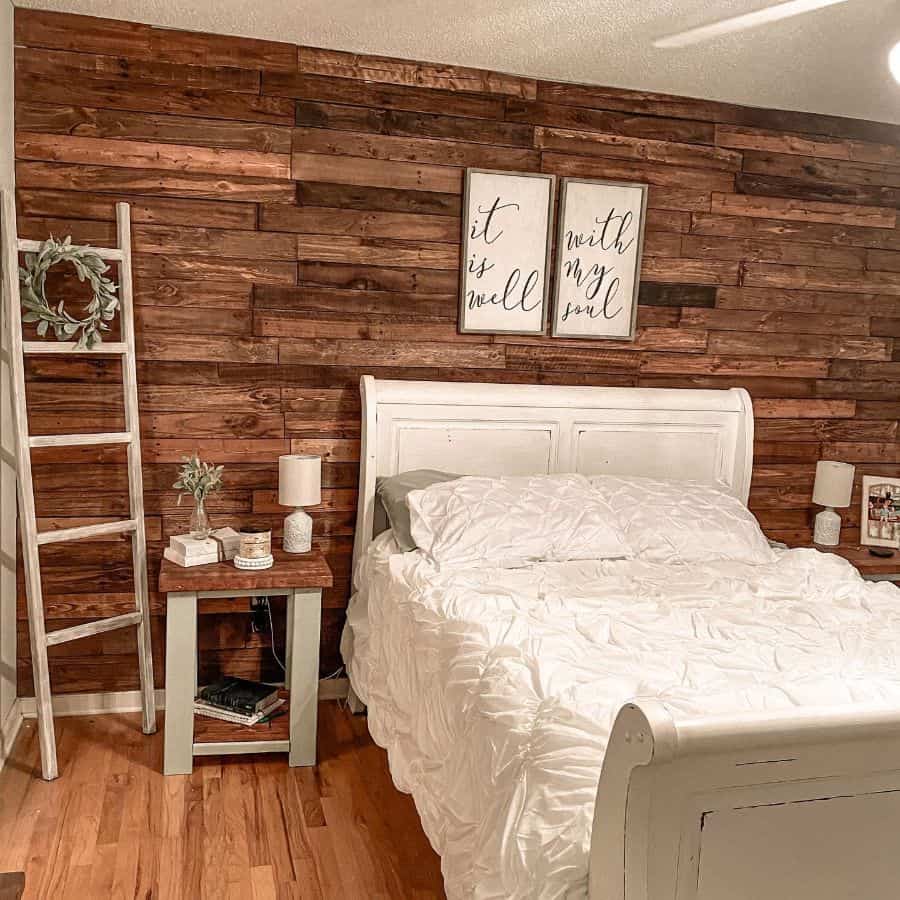 Rustic bedroom with wooden panels and ladder decor 
