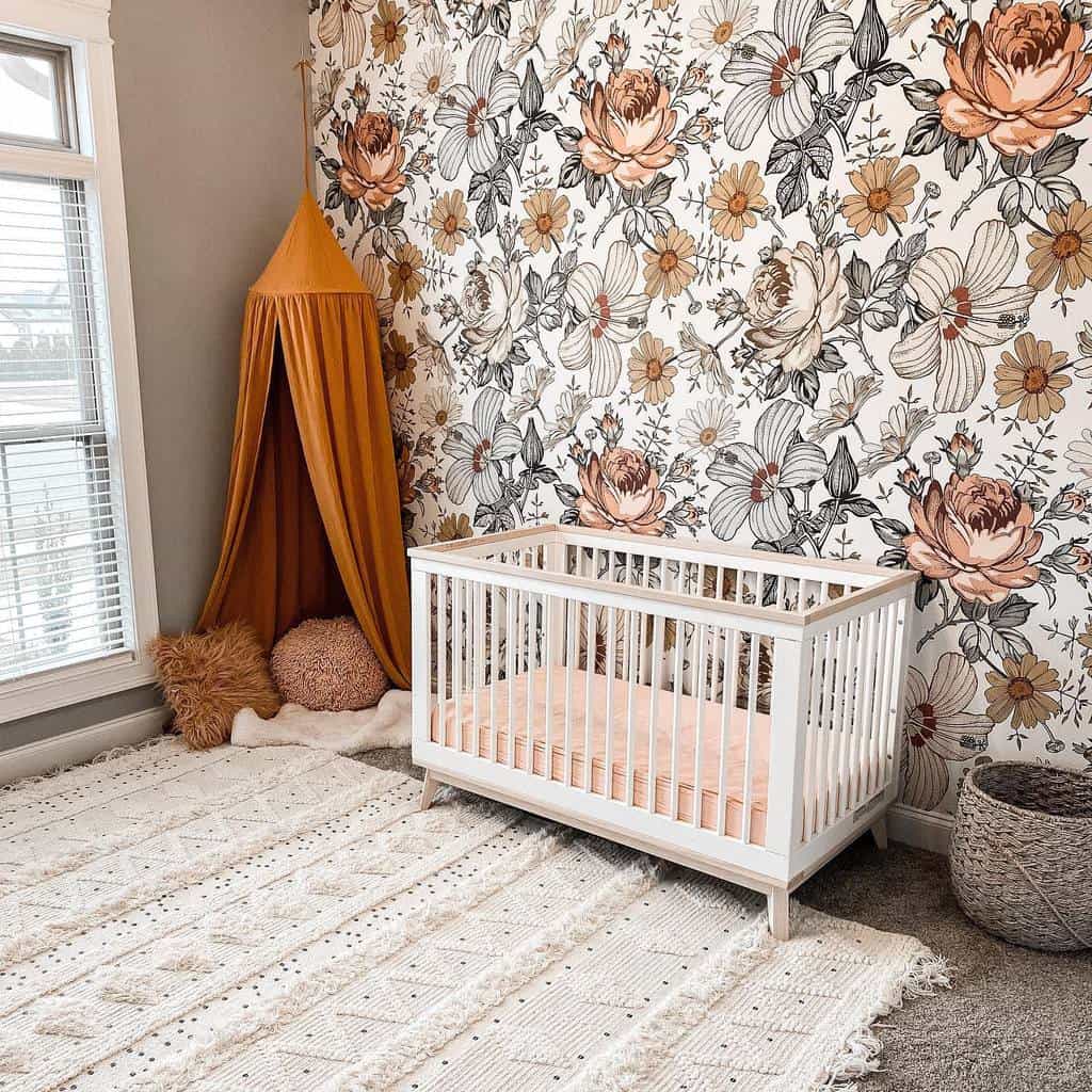 Floral wallpaper for baby room, white cot, orange teepee 