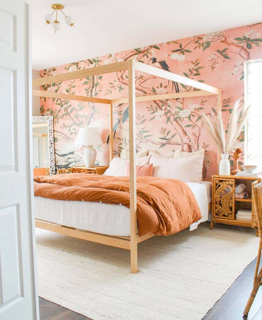 Pink floral wallpaper, wooden four-post bed