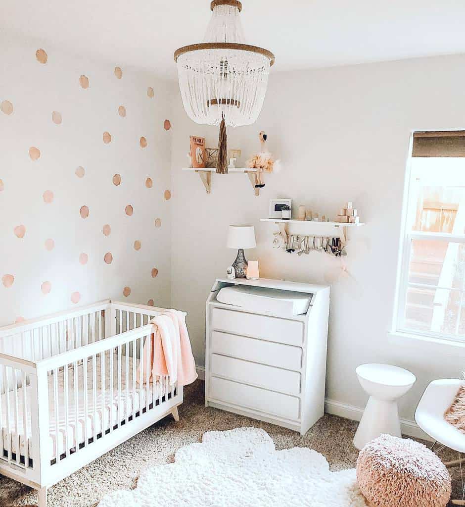 Circle wallpaper for baby room, white wall shelves for cots 