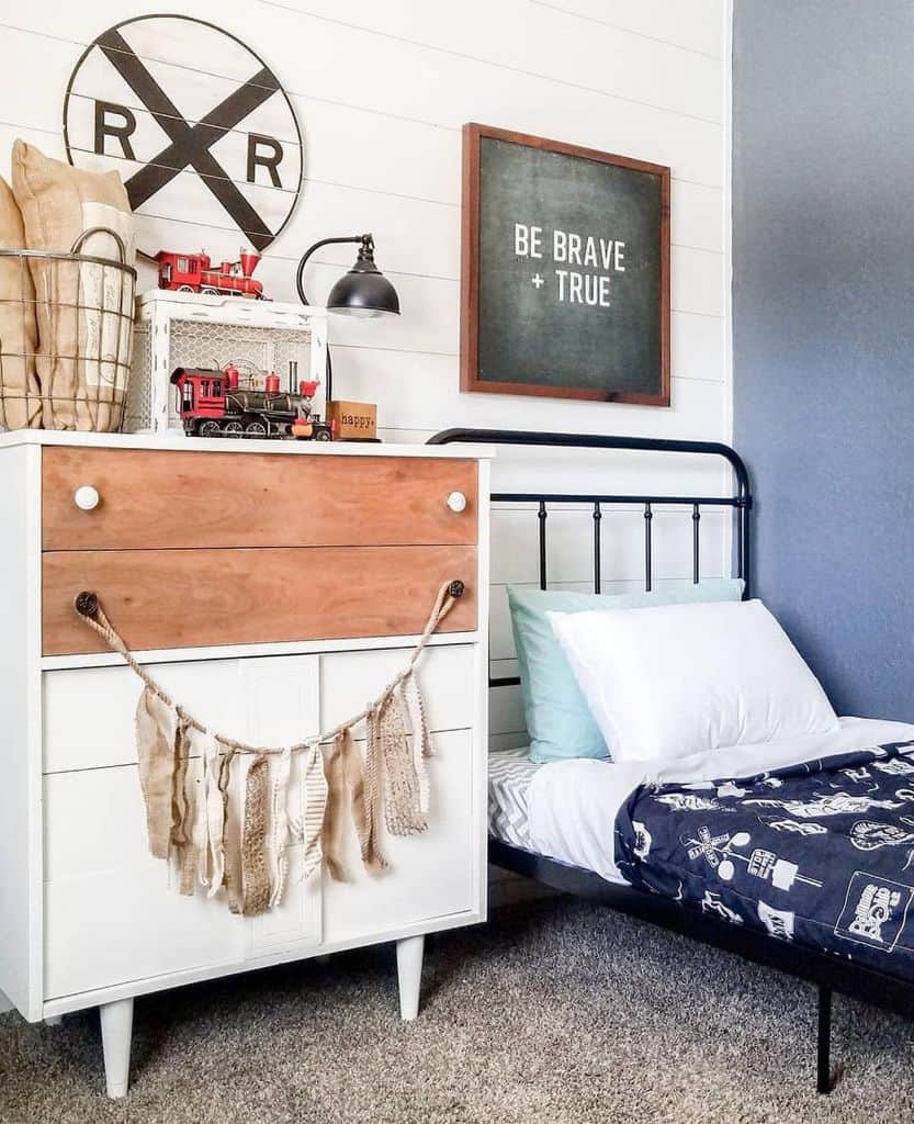 White vintage style boy's bedroom with shiplap wall 
