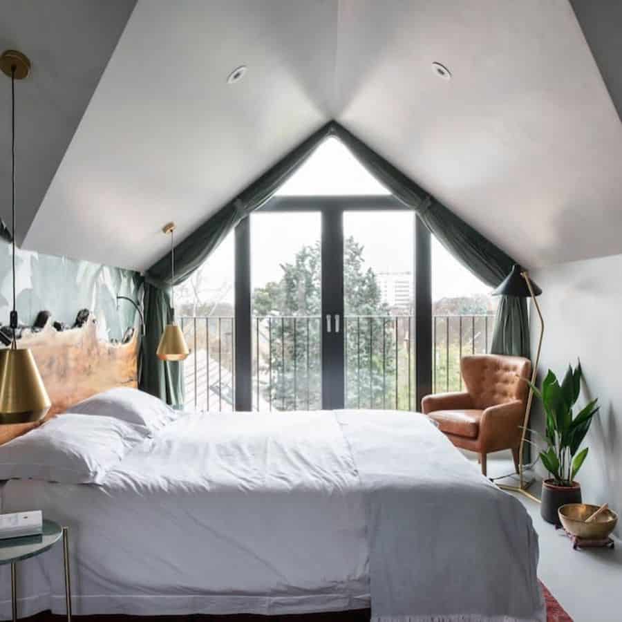 small bedroom in the attic with a view of the city 