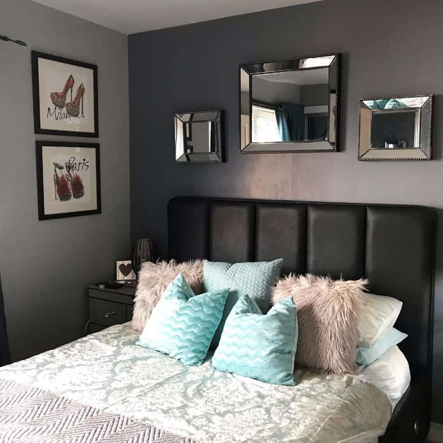 Stylish small bedroom with black bed