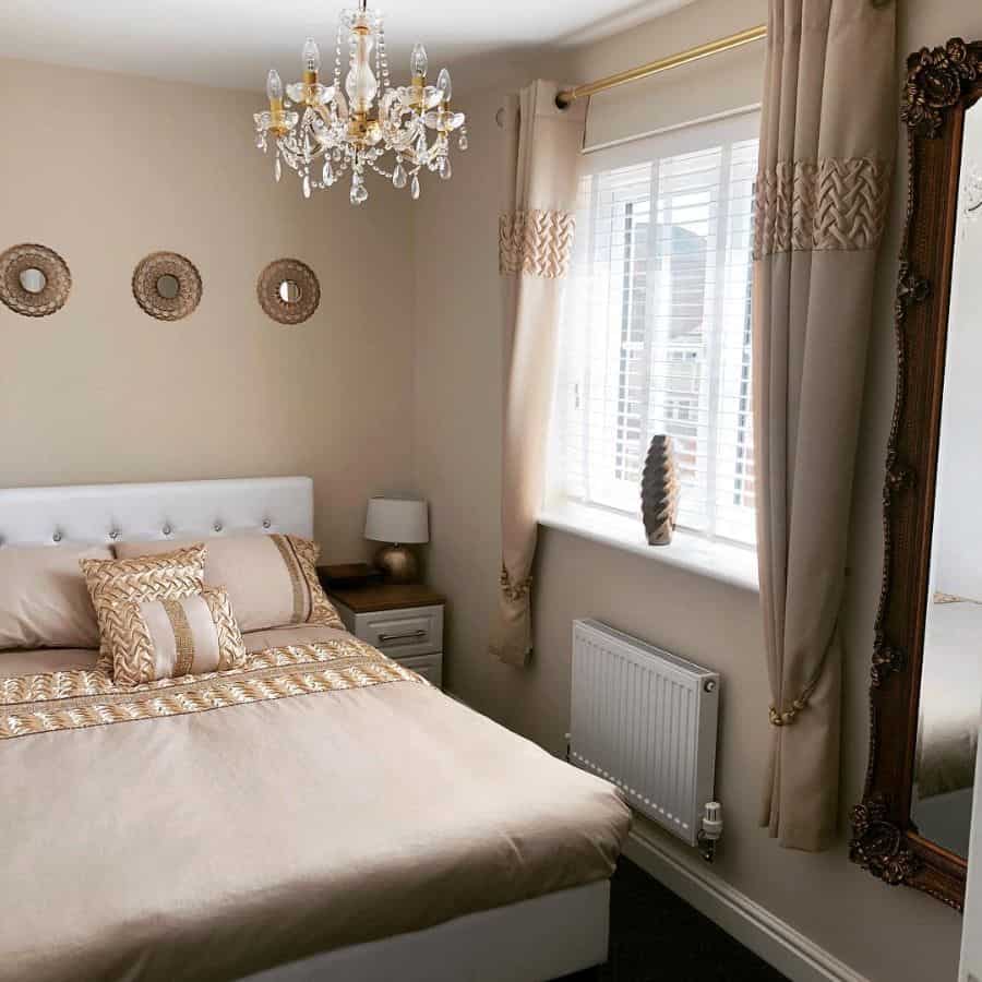 Elegant bedroom in neutral colors with chandelier