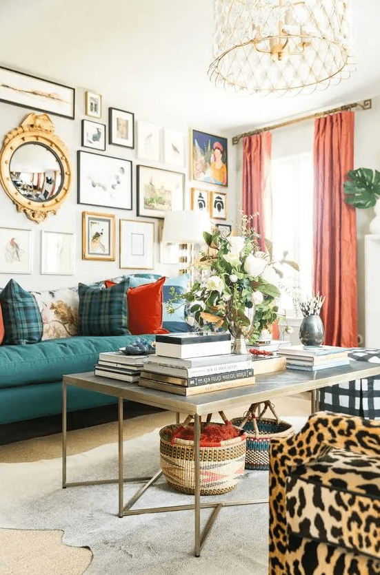 a maximalist living room with a striking green sofa and leopard armchairs, a gallery wall with bright artwork and colorful curtains