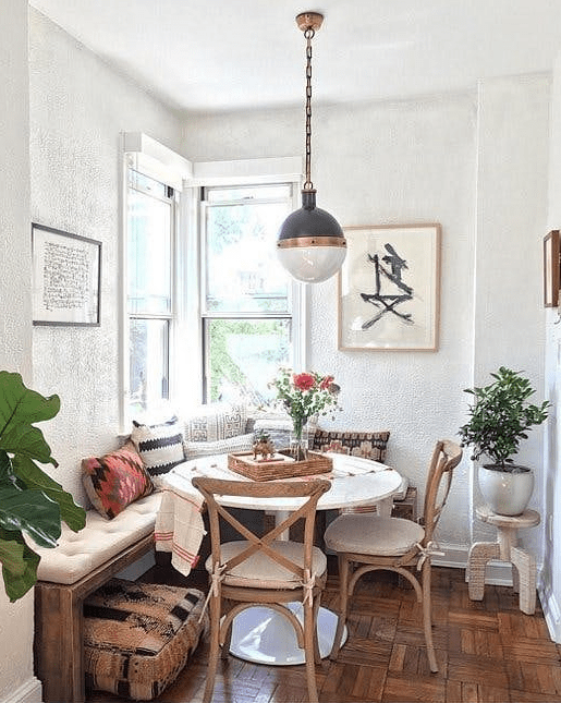 Use a corner of your kitchen to create a small but cozy dining area like this one