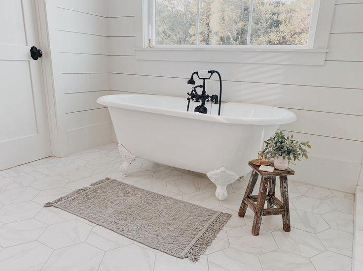 Add a wooden stool for a rustic touch in your boho bathroom
