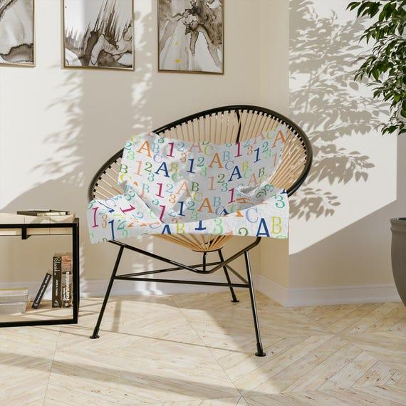 Embrace cozy blankets to make your Nursery Nook feel extra inviting and warm