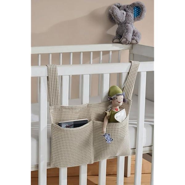 Use a mobile with storage pockets in your small nursery