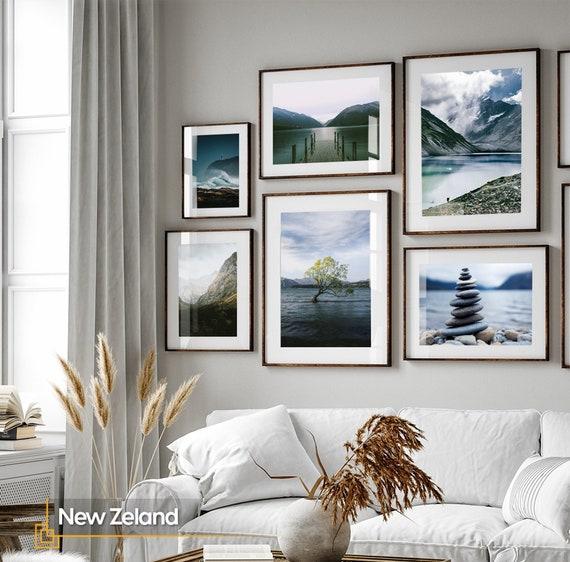 Showcase a gallery wall of scenic landscapes to evoke serenity in your earthy living room