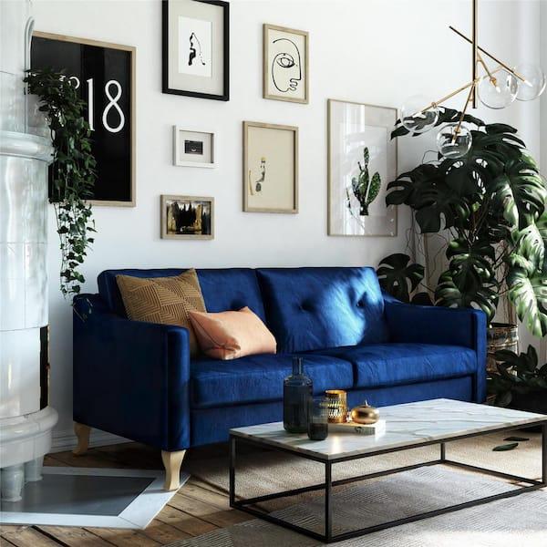 Mix textures like velvet and linen for a cozy blue living room
