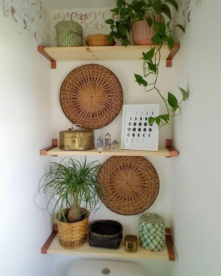 Use open shelving to display decorative items in your boho bathroom