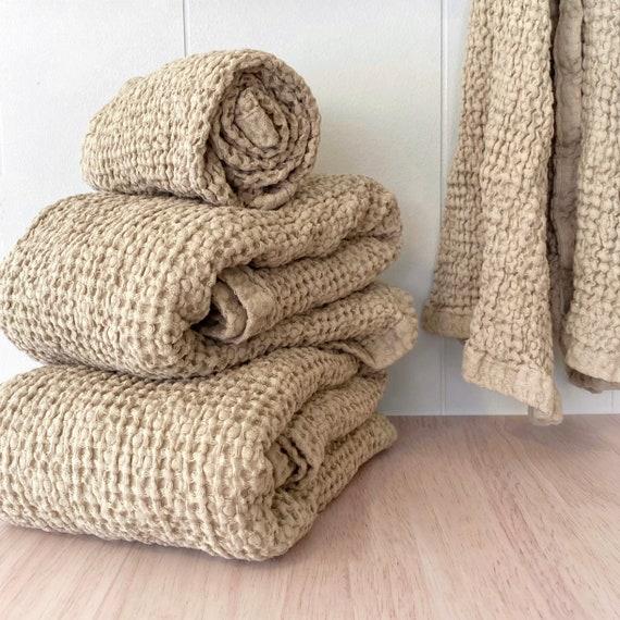 Soft textiles, like linen towels, bring comfort to your inviting Farmhouse Bathroom